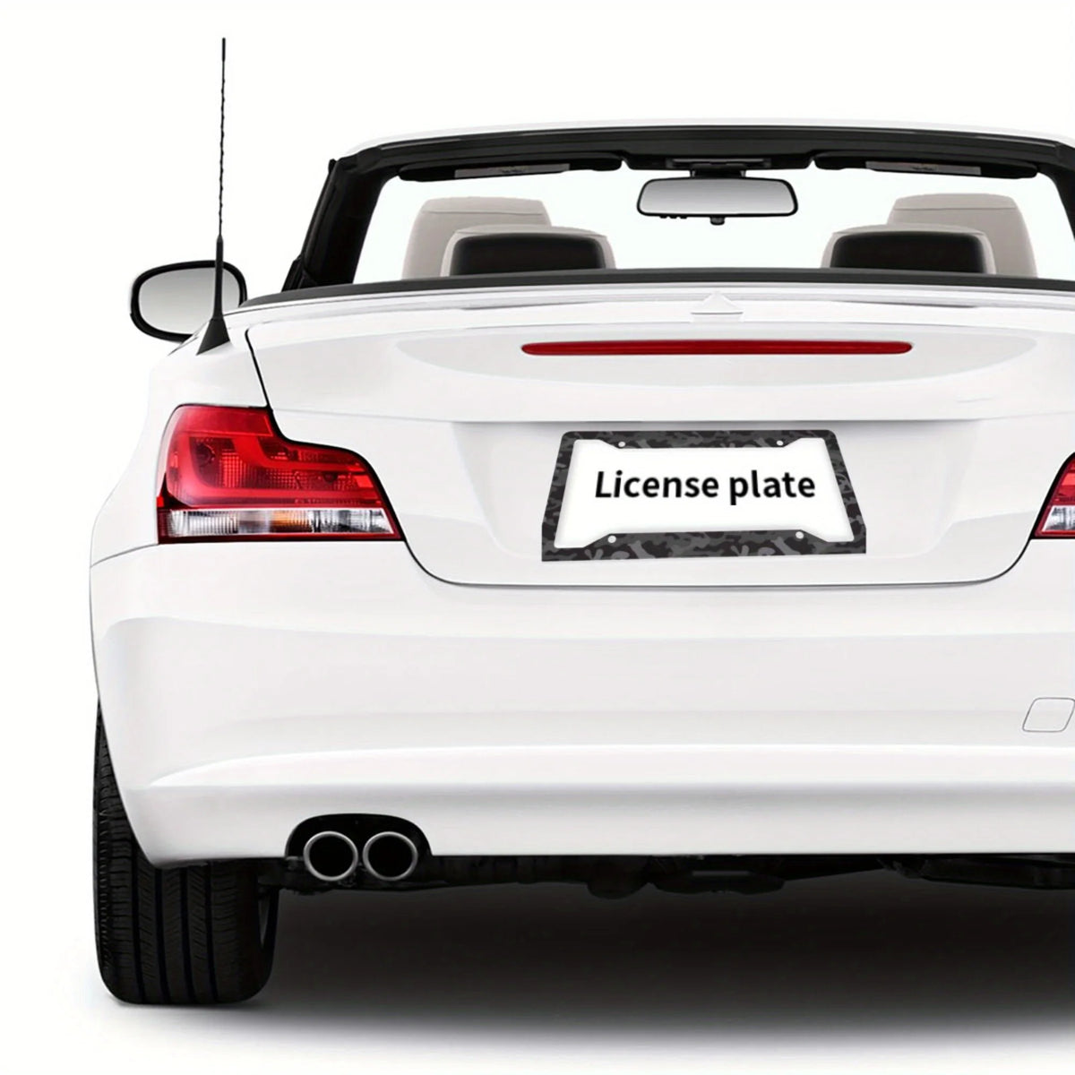 Rear view of a white car with a license plate frame installed.
