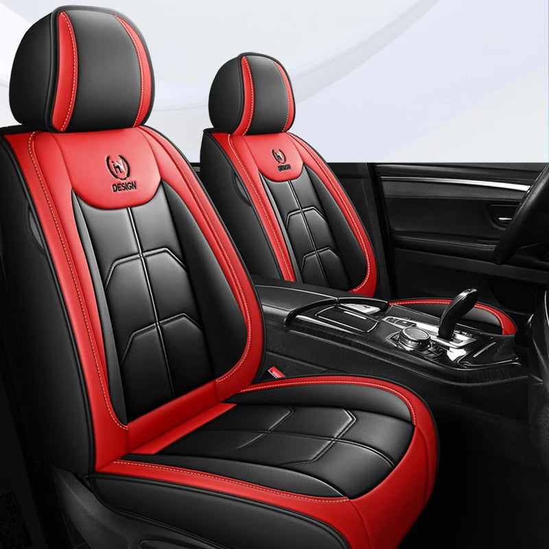 A pair of black and red leather car seat covers shown in a car interior setting.