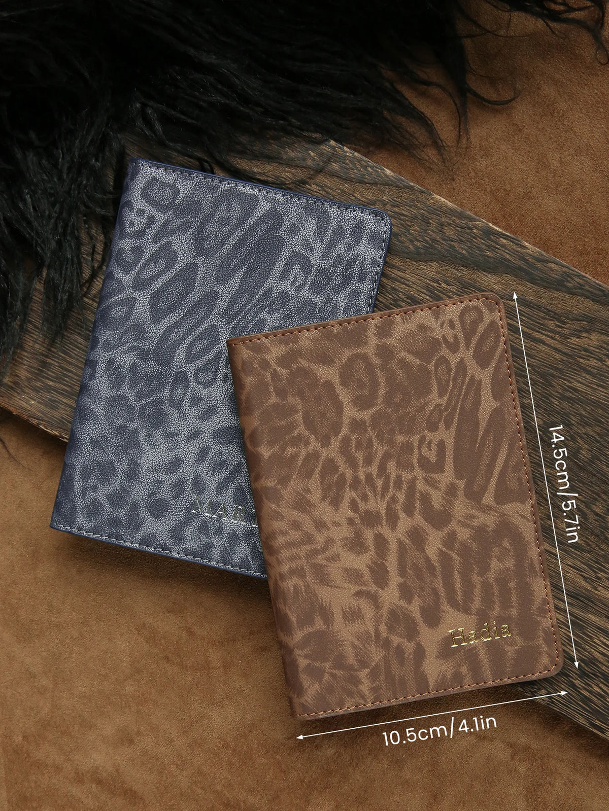 A brown leather passport holder with a leopard print design is shown resting on a wooden surface.