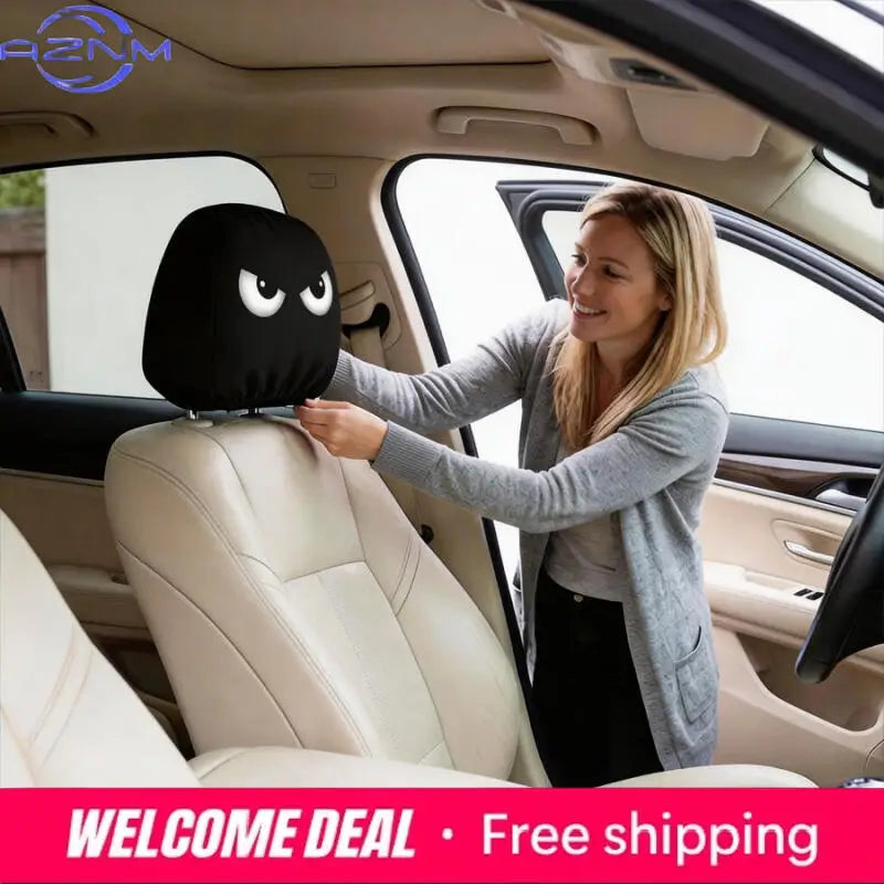 A woman is installing a black angry eyes car headrest cover in a car interior.