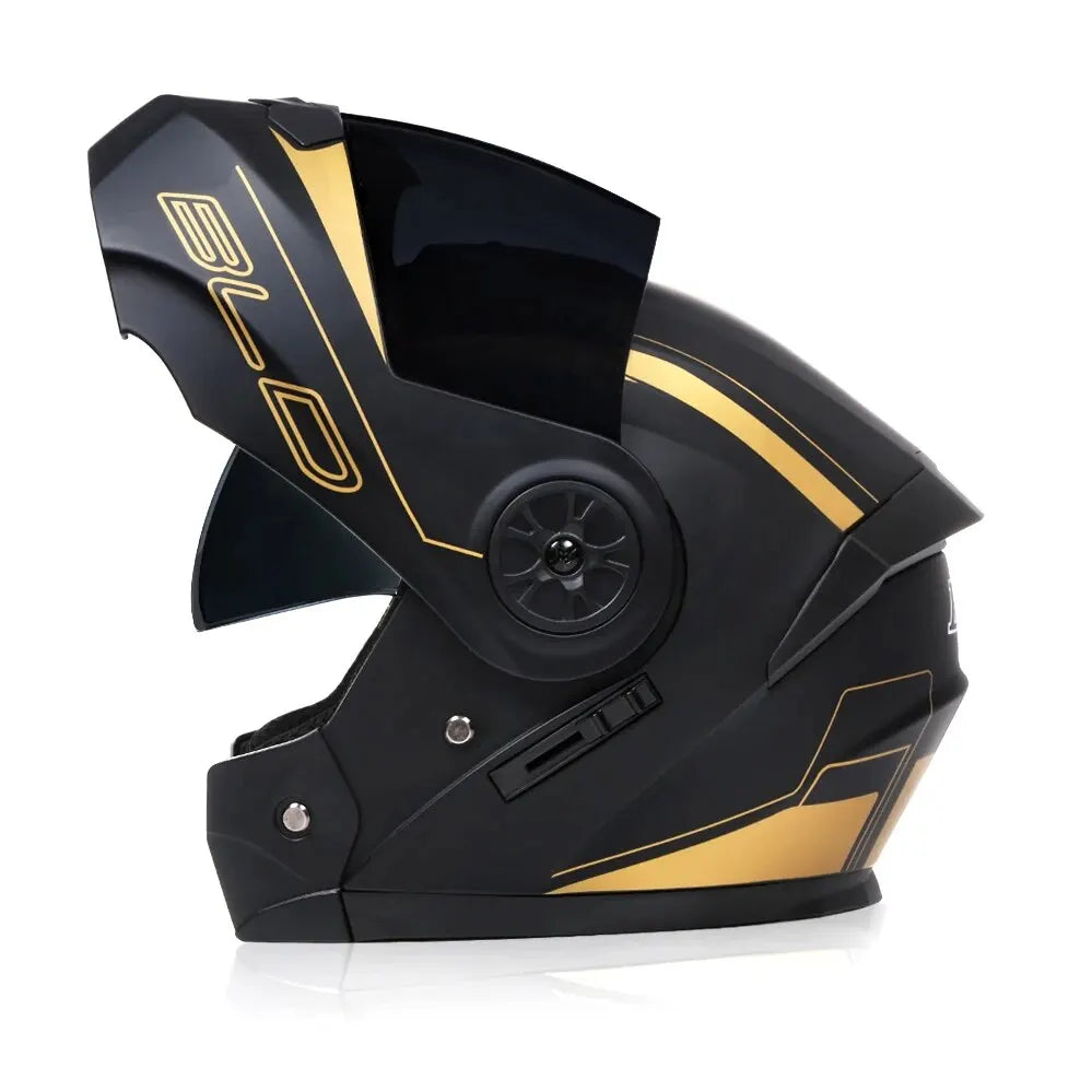A black motorcycle helmet with gold accents and a flip-up visor is shown from the side.