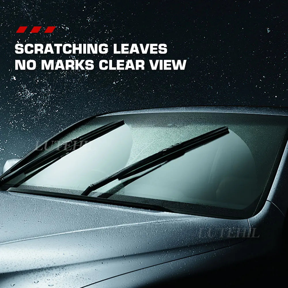 Close-up of a car windshield showing scratches and marks on the glass.