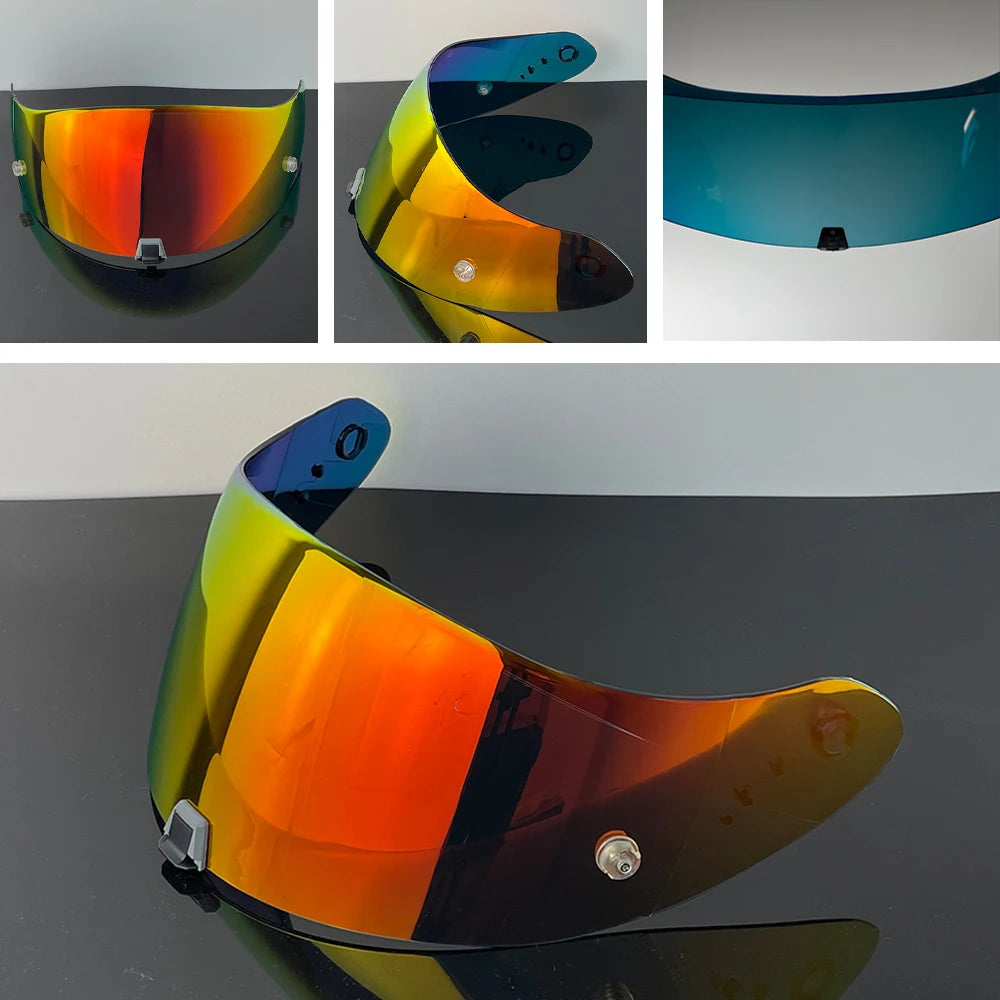 A motorcycle helmet visor lens in various colors, including orange, yellow, and blue tints.