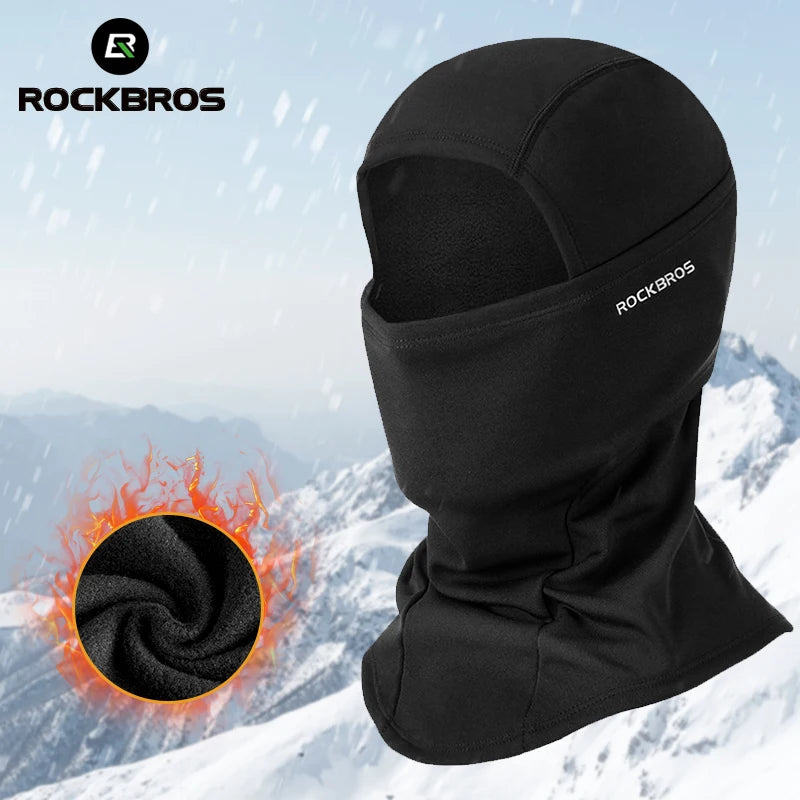 Black Rockbros thermal fleece balaclava worn by a person in a snowy outdoor environment