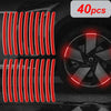 40 pieces of multi-color reflective safety stickers for wheels and helmets displayed on a car wheel.