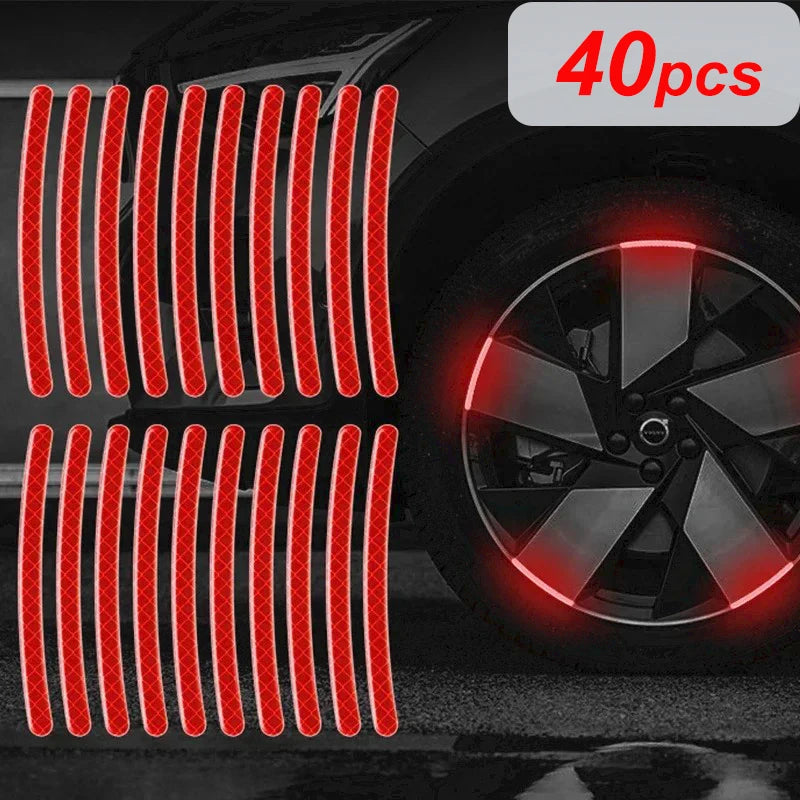 40 pieces of multi-color reflective safety stickers for wheels and helmets displayed on a car wheel.