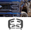 Close-up of a blue Ford F-250 or F-350 grille and headlight assembly.