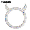 Tapa de perilla de ignición circular decorada con pedrería brillante y piedras de colores.