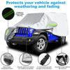 A silver waterproof car cover with reflective stripes protecting a blue Jeep Wrangler against weathering and fading.