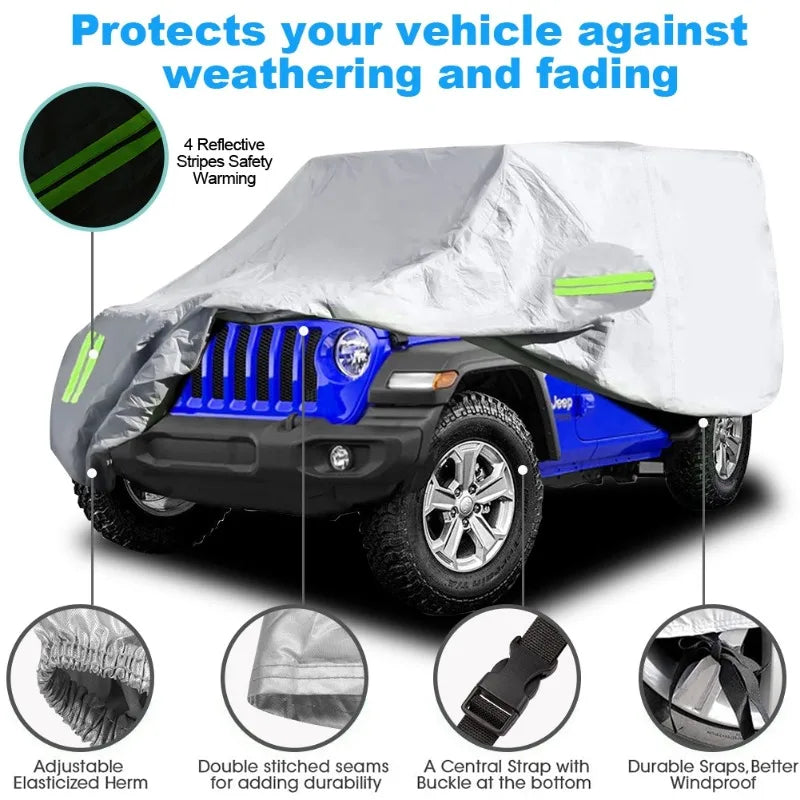 A silver waterproof car cover with reflective stripes protecting a blue Jeep Wrangler against weathering and fading.