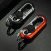 A close-up view of a shiny red and silver rotatable lock carabiner keychain against a dark background.