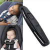 A black car seat belt clip designed for child safety harnesses, shown alongside a baby wearing the harness.