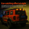 Orange Jeep truck equipped with eye-catching front and rear lights for nighttime visibility.