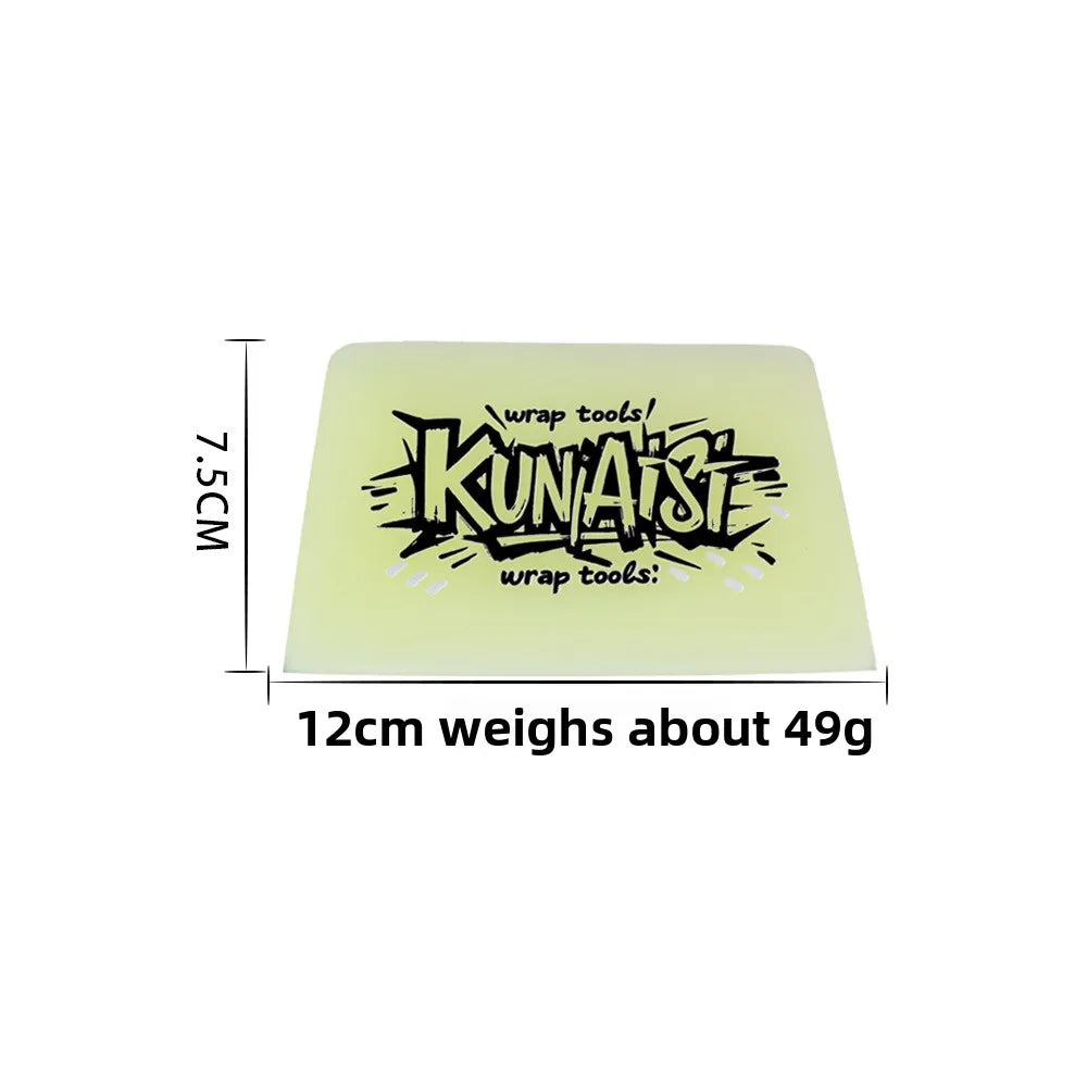 A rectangular piece of light green rubber used as a wrap tool for removing car film.