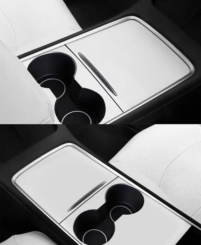 A close-up view of a wood grain dashboard cover for a Tesla Model Y showing a black and white interior detail.