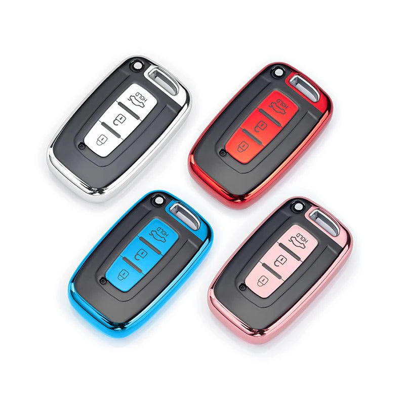 Three universal car key case covers in black, red, and pink colors shown from above.