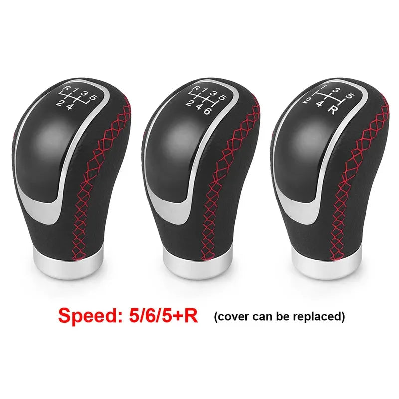 Three black manual gear shift knobs with interchangeable speed covers labeled 5/6/5+R