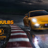 A yellow car is shown with bright LED light bulbs installed, demonstrating high performance and longevity.