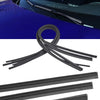 A set of black natural rubber windshield wiper blade inserts for a car.