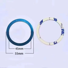 A circular, light-colored magnetic mount with markings and dimensions shown against a white background.