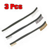 Three long black detailing brushes with various bristles and picks for car cleaning