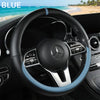 Blue leather steering wheel cover for a Mercedes vehicle interior.