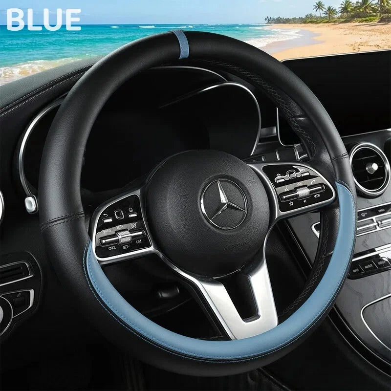 Blue leather steering wheel cover for a Mercedes vehicle interior.