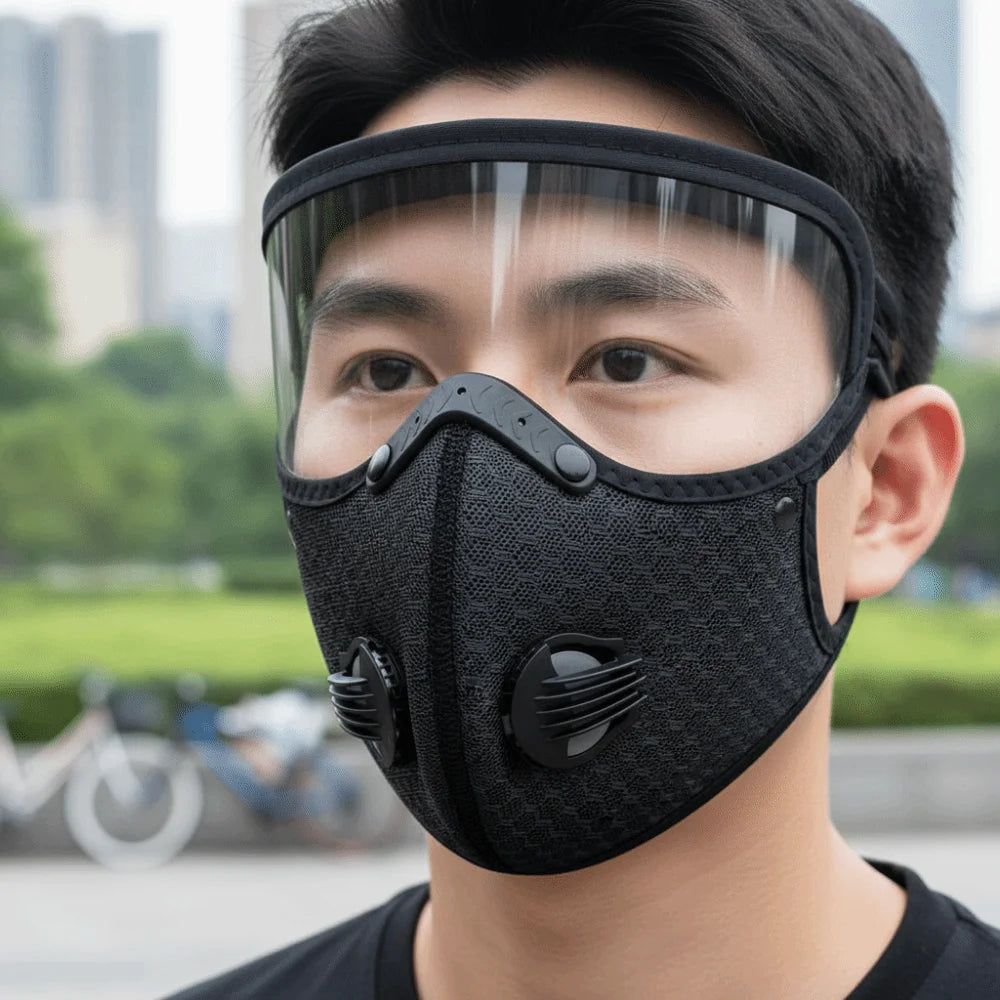 A close-up of a man wearing a black breathable cycling and outdoor face mask.