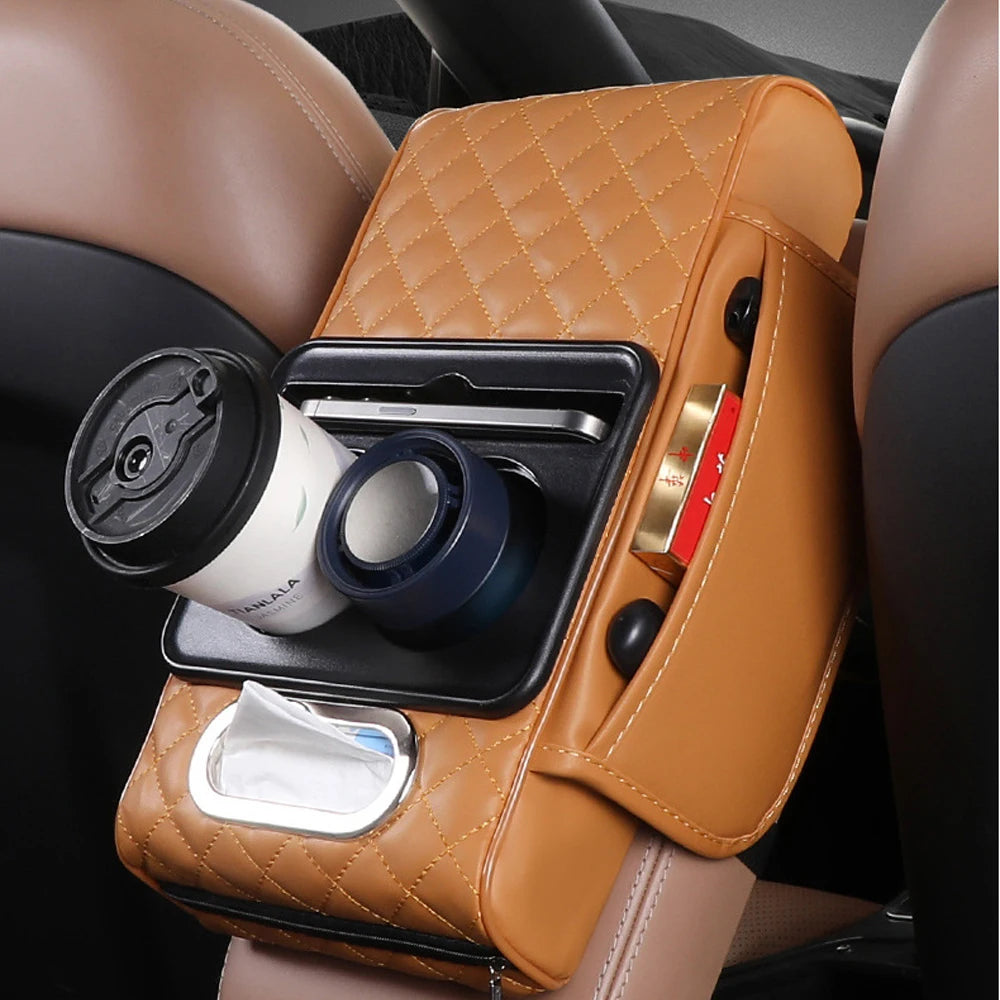 A brown quilted car armrest cushion with a built-in slot for holding tissues and other small items.