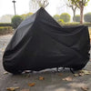 Black heavy-duty universal motorcycle cover protecting a vehicle outdoors.