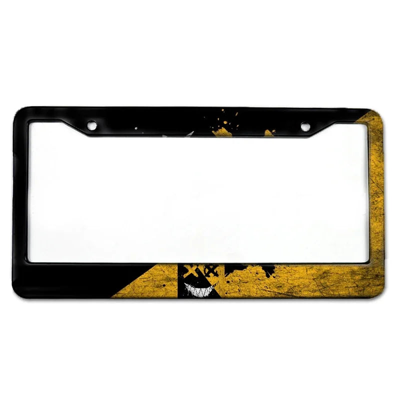 Black license plate frame with a white interior and gold distressed accents.