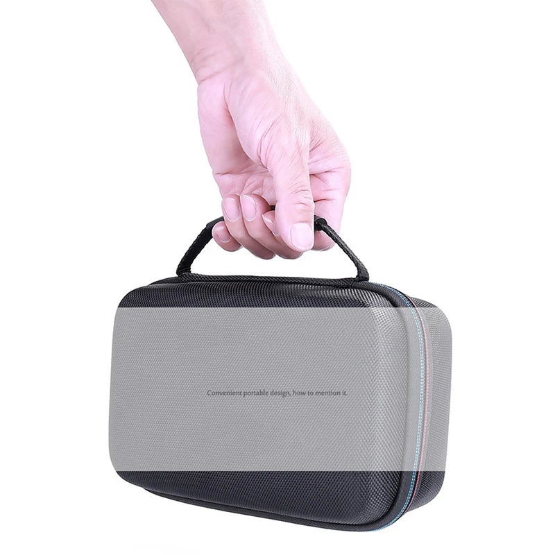 A hand holds a gray protective case for a lithium jump starter.