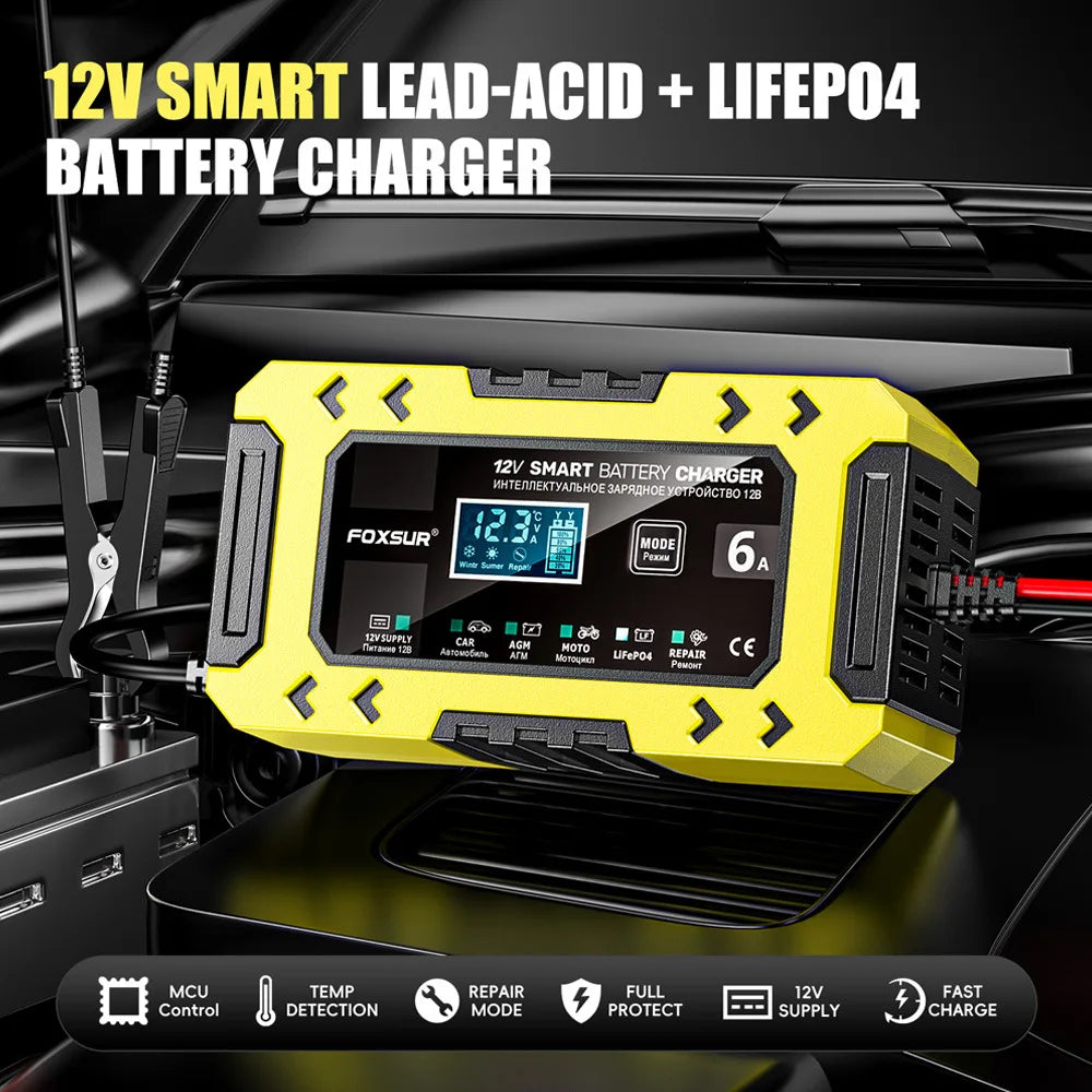 A yellow 12V smart lead-acid and LiFePO4 battery charger device is shown in a close-up on a black surface.