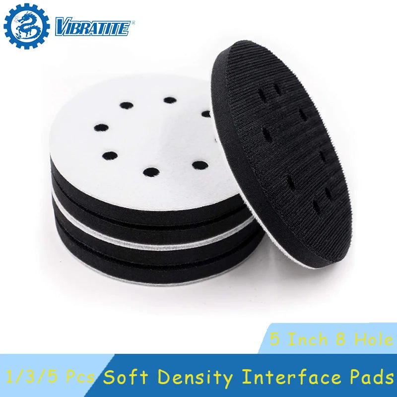 Three black abrasive interface pads with holes stacked on a white background.