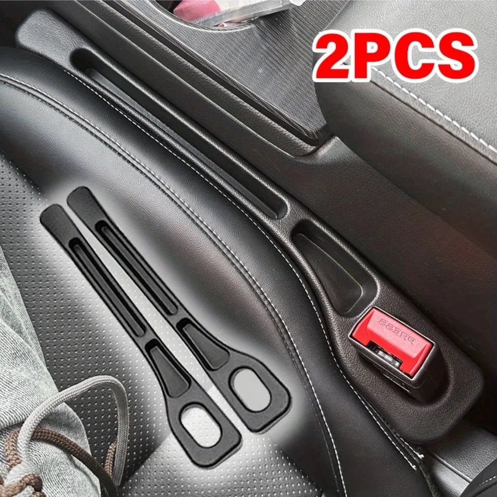 Two black car seat gap filler organizers are shown inside a car seat, ready for use.