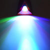 A bright white light beam shines forward from a shark fin roof light, illuminating the surrounding area with green and blue h