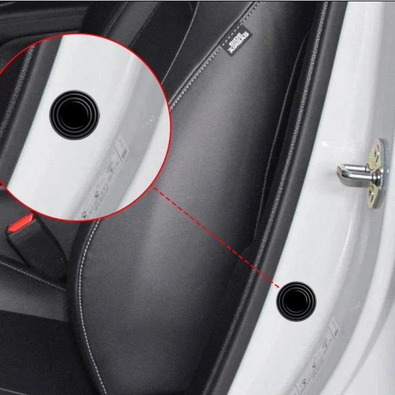 Close-up view of a car door showing anti-shock silicone pads used for soundproofing and vibration dampening.