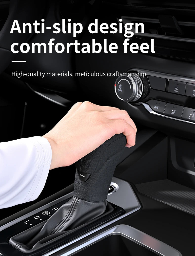 A hand is shown placing a black anti-slip gear shift knob cover onto a vehicle's transmission.