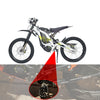 A white dirt bike with heavy-duty CNC foot pegs installed, showing a close-up of the pegs.