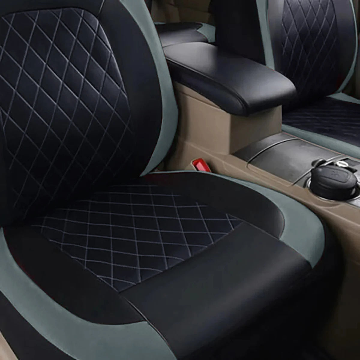 Close-up view of black and gray PU leather car seat covers with diamond stitching on a vehicle seat.