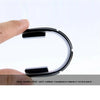 A hand holds a black silicone car door edge protector strip, demonstrating its impact resistance.