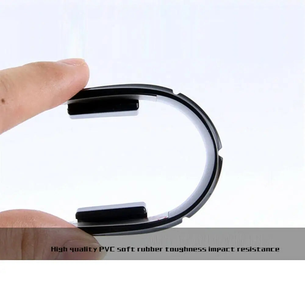 A hand holds a black silicone car door edge protector strip, demonstrating its impact resistance.