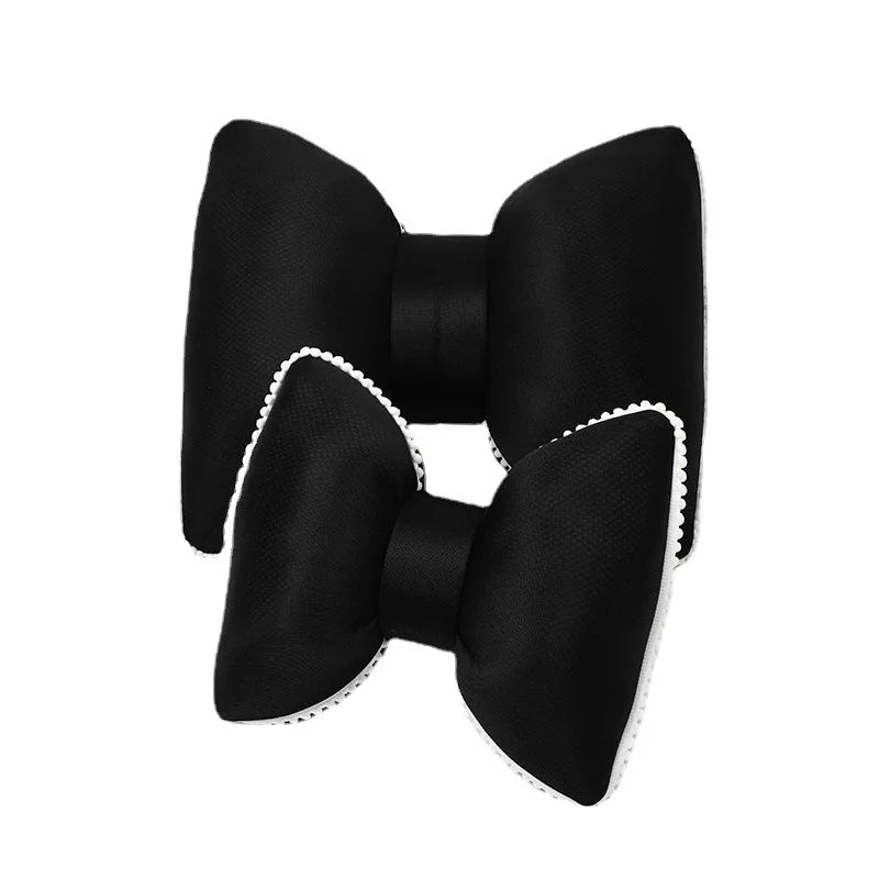 Black ergonomic car headrest pillow with a decorative bow design