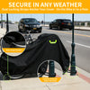 Black waterproof bicycle cover with dual locking straps shown on a bike and anchored to a pole