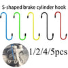 S-shaped brake cylinder hooks in blue, green, yellow, black, and red colors shown next to a close-up of a suspension disc ser