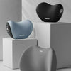 A set of black and light blue ergonomic memory foam pillows displayed on white cubes.