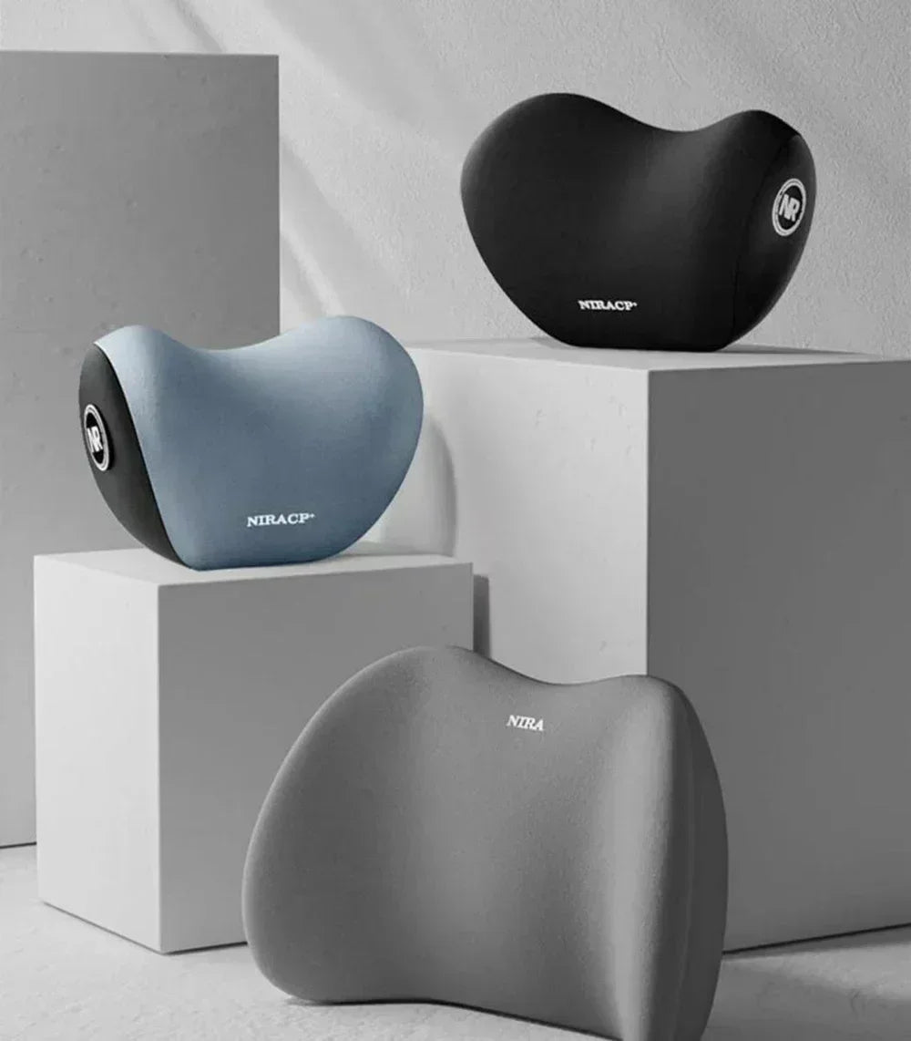 A set of black and light blue ergonomic memory foam pillows displayed on white cubes.