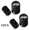 Four black Jeep skull tire valve caps shown individually on a white background.