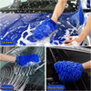 Blue microfiber mitts cleaning car paint, windshield, and plastic parts.