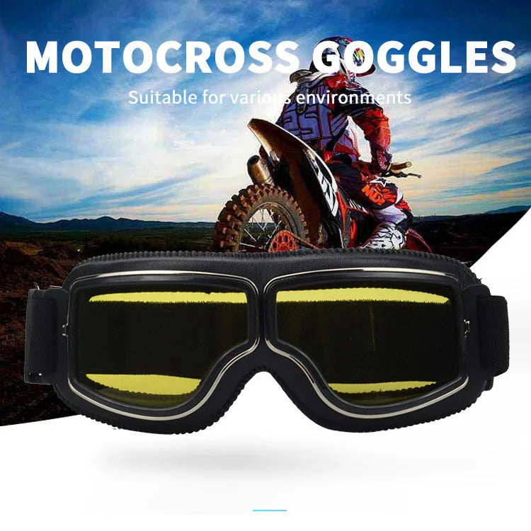A pair of black retro folding motorcycle windproof goggles displayed against a background of a motocross rider and landscape.
